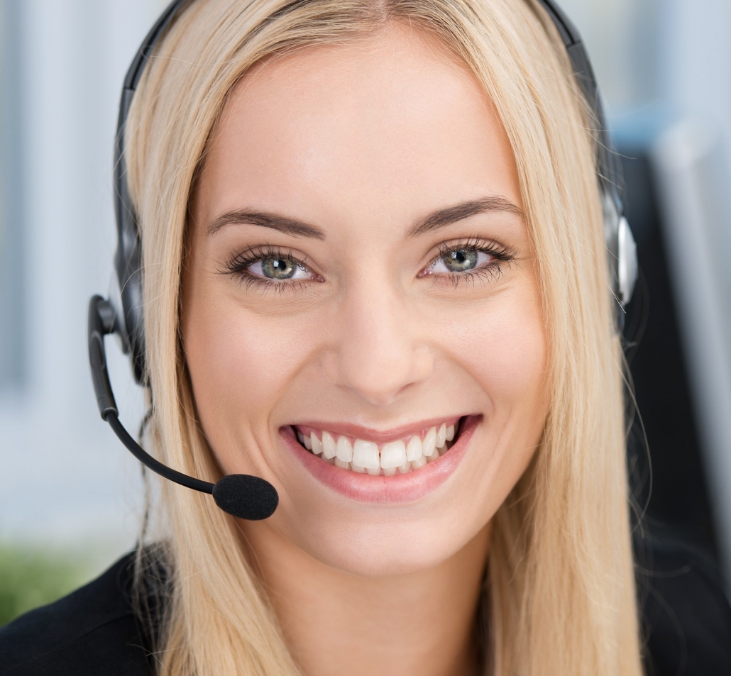Customer service representative with a headset, smiling.