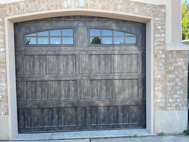 Dark Wood Grain Garage Door with Windows