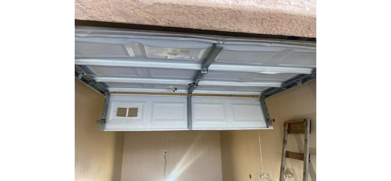 Garage door warning signs Layton Utah - door off its track before professional repair